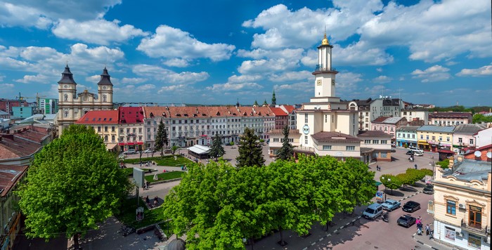 Town square with church and clock tower in Ivano-Frankivsk, Ukraine