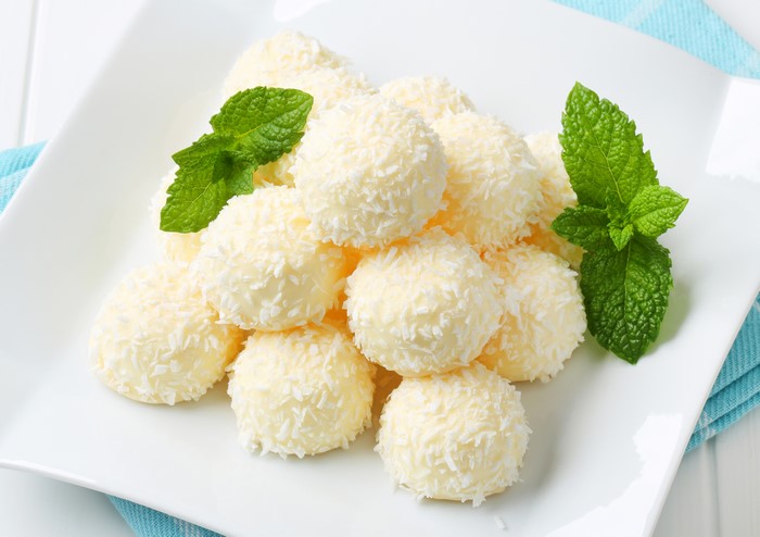 White coconut balls with mint leaves