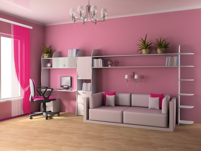 Pink children's room with desk, chair, and sofa