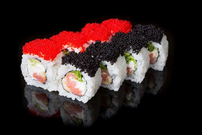 Sushi rolls with red and black caviar