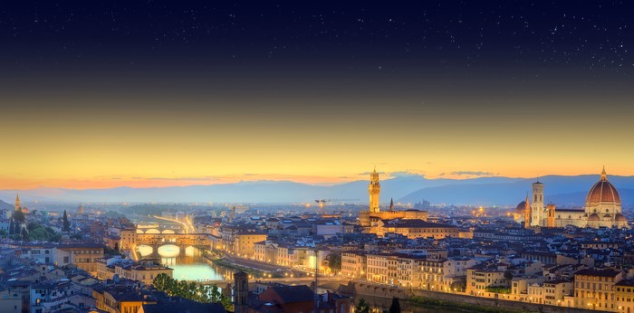 Florence cityscape with Arno River and bridges at dusk