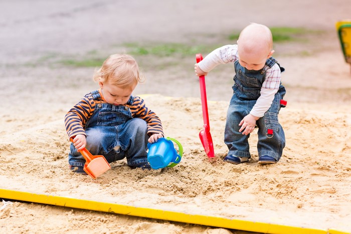 Two Boys Playing in a Sandbox