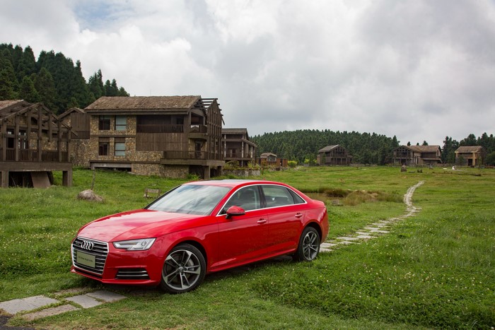 Red Audi A4 L 45 TFSI quattro in a village