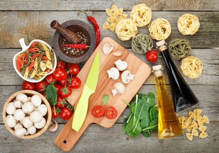 Ingredients for Italian Cooking on Wooden Table