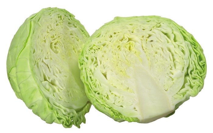 Two halves of a green cabbage on a white background