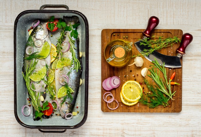 Fish with Lemons, Herbs, and Spices on Cutting Board