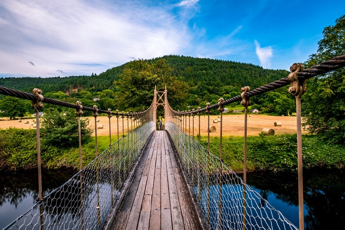 Suspension bridge over a river in the Conwy Valley, Wales