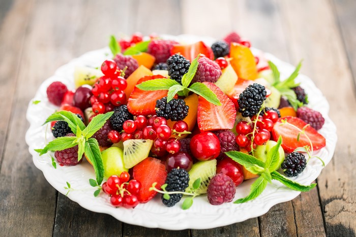 Fruit Salad with Berries and Mint on a Plate