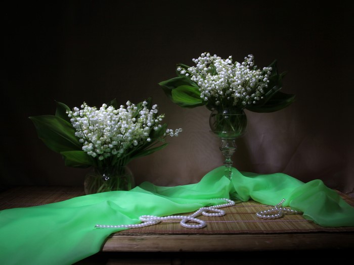 Two vases of lilies of the valley with pearls