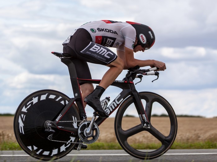 Cyclist in BMC racing gear on a time trial bike