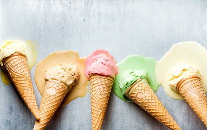Ice cream cones melting on a surface
