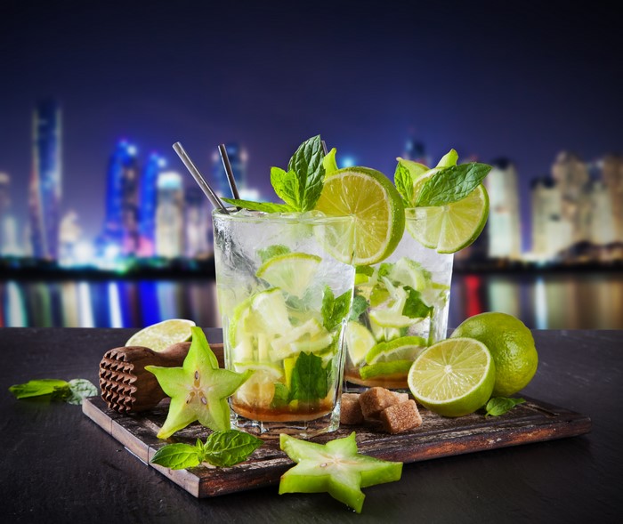 Mojitos with Lime and Mint in Highball Glasses