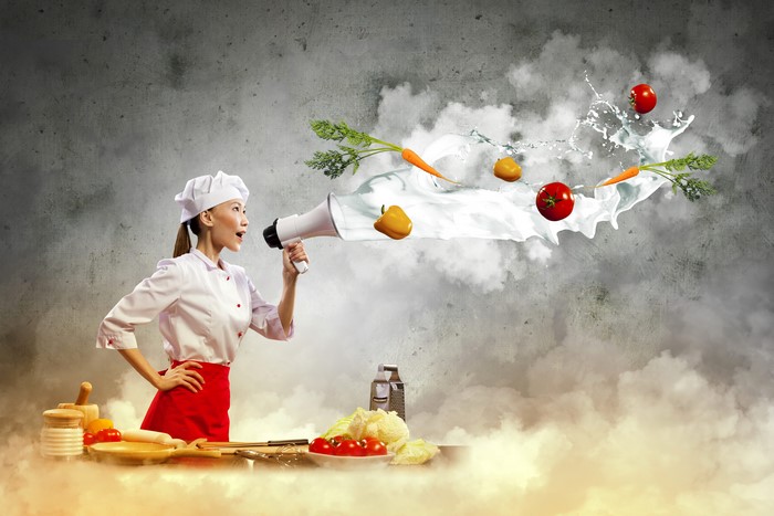 Chef with Megaphone and Flying Vegetables