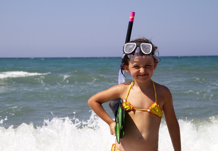 Smiling Little Girl in Snorkel Gear by the Sea 4K
