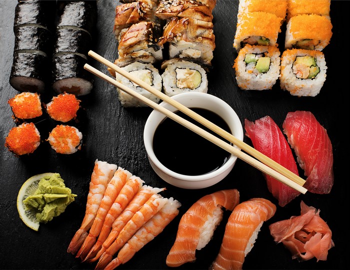Sushi and Chopsticks on Black Slate