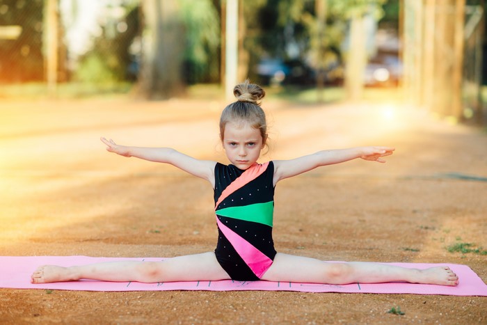 4K Image of Little Girl Doing Gymnastics Split