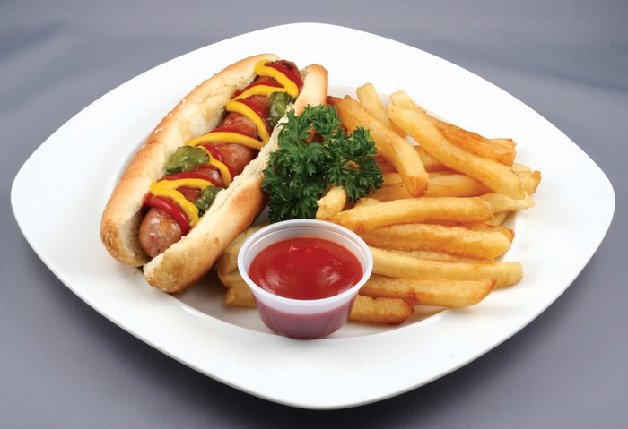 Hot dog with french fries and ketchup on a plate