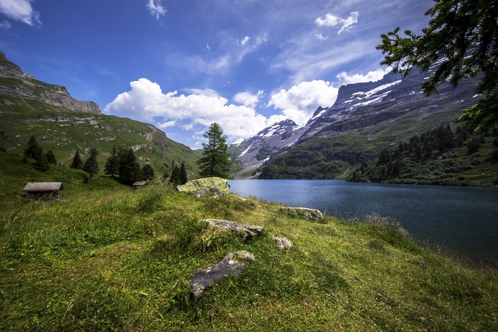Engstlensee lake with mountains and cabins in Switzerland