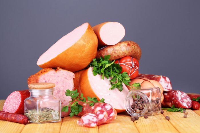 Meat products, sausages, spices, and wood planks