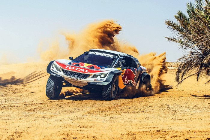 Peugeot 3008 DKR Dakar Rally car driving through sand