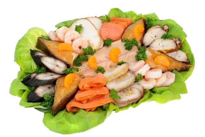 Seafood platter with fish, shrimp, and garnishes