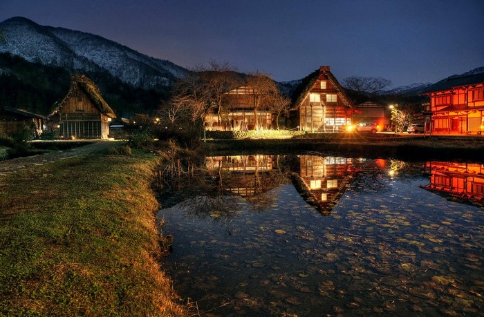 Shirakawa-mura village at night with pond reflection