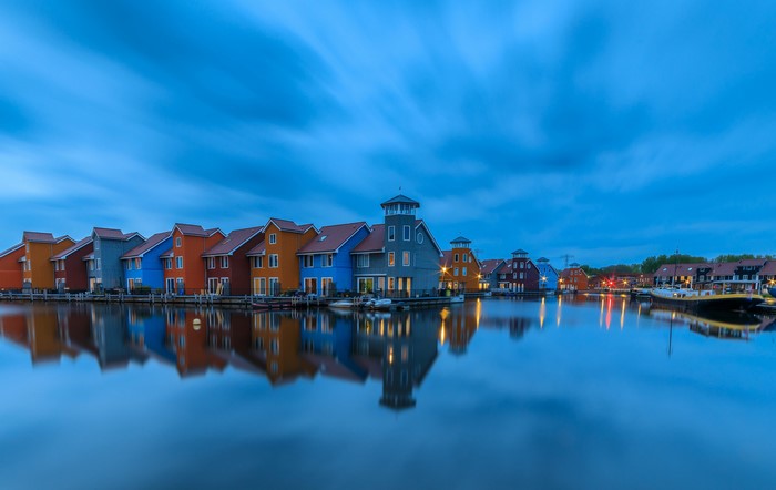 Colorful houses on the water in Groningen, Netherlands at dusk