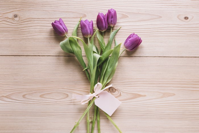 Purple Tulips with Gift Tag on Wood Planks