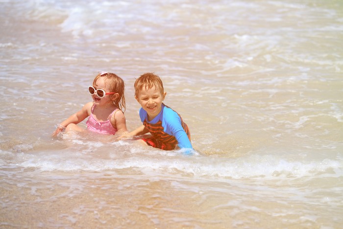 Two children playing in the sea