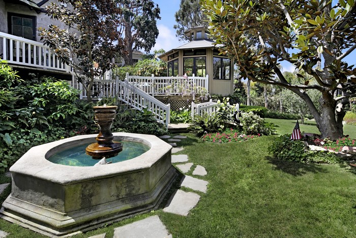 Garden with fountain, gazebo, and American flag