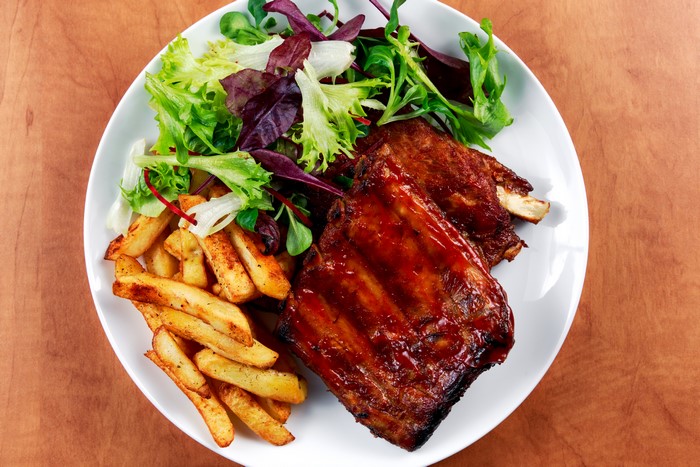 Barbecue ribs with french fries and salad