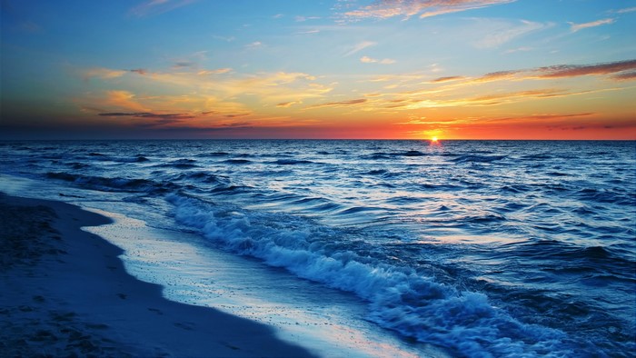 Ocean waves at sunset