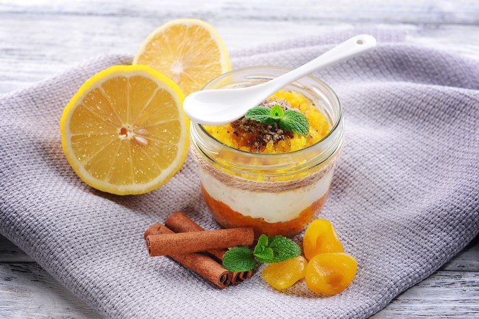 Dessert in a jar with lemons and cinnamon