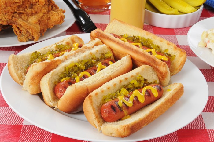 Plate of hot dogs with relish and mustard