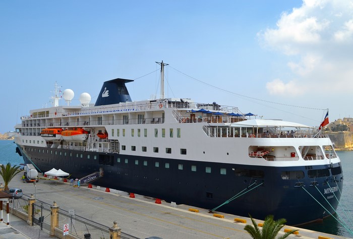 Minerva cruise liner docked at a marina