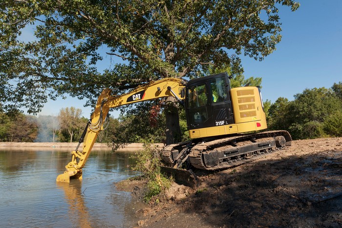 Caterpillar 315F L excavator in a pond
