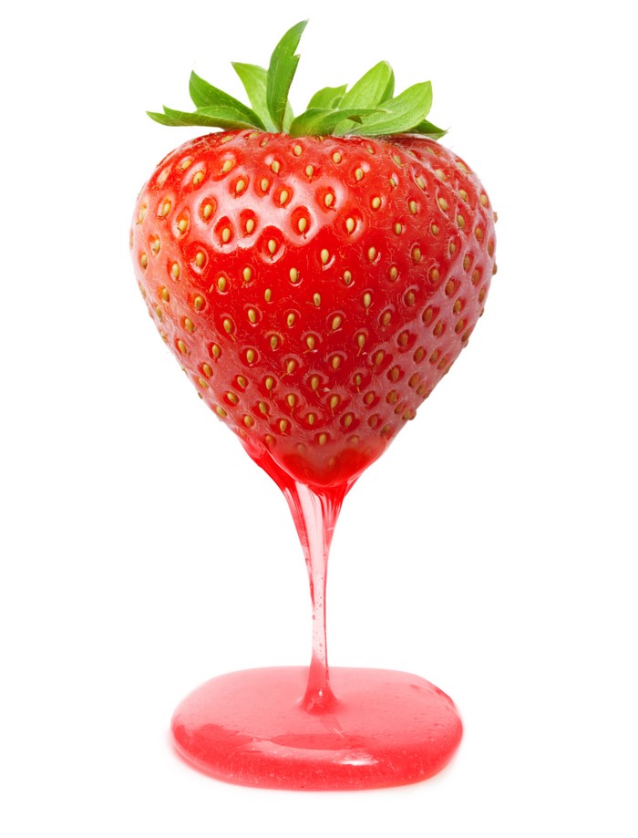 Strawberry with dripping juice on white background
