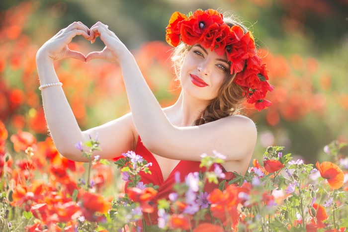Woman with Poppy Wreath Making Heart Shape