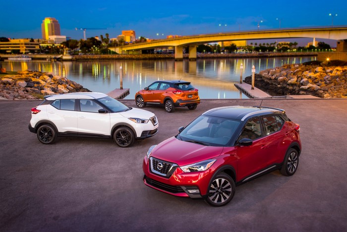 Three Nissan Kicks cars by the water