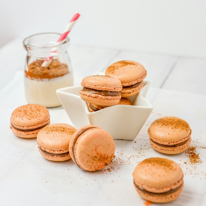 Macarons with cinnamon and a glass of milk
