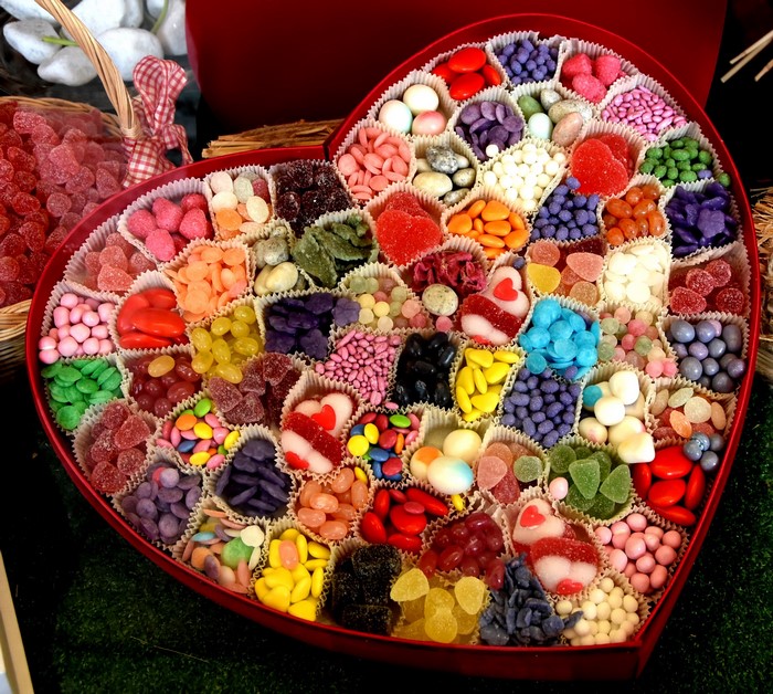 Heart-shaped box filled with assorted candies