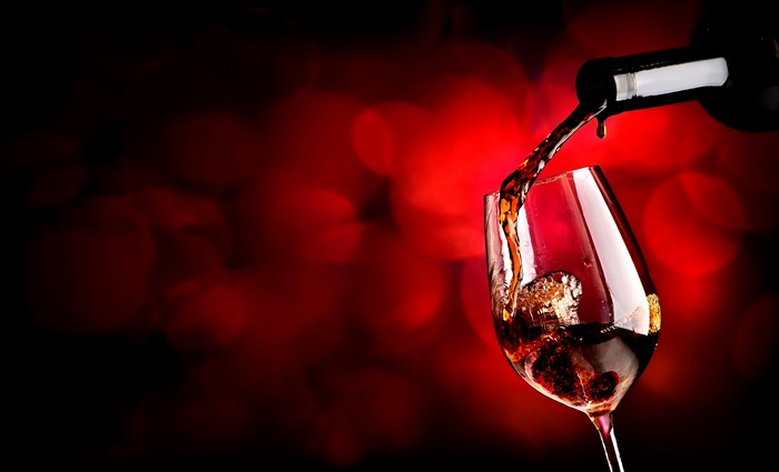 Wine being poured into a glass