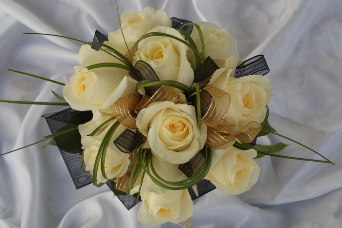 White rose bouquet with black and gold ribbon