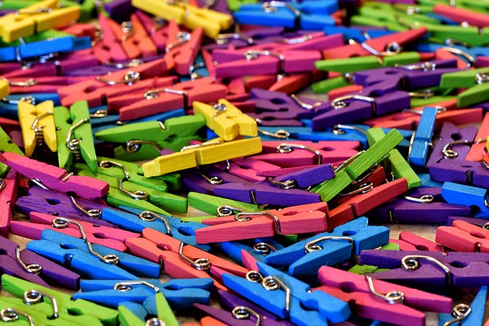 Pile of colorful wooden clothespins