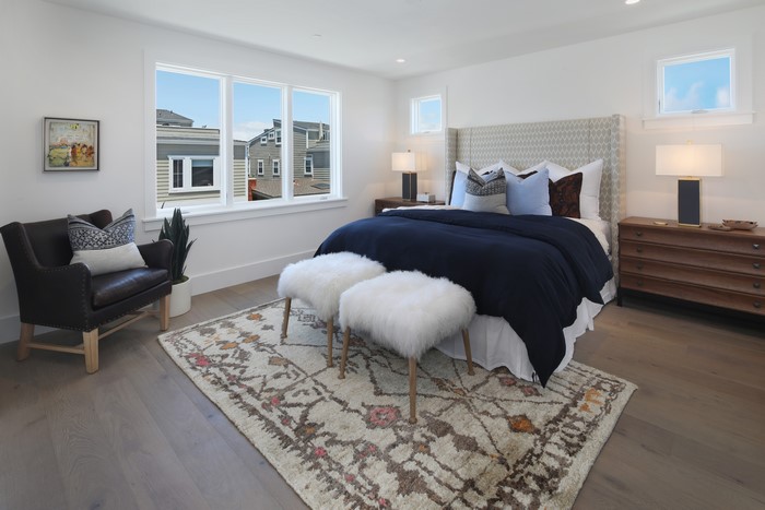 Bedroom with Bed, Armchair, and Carpet