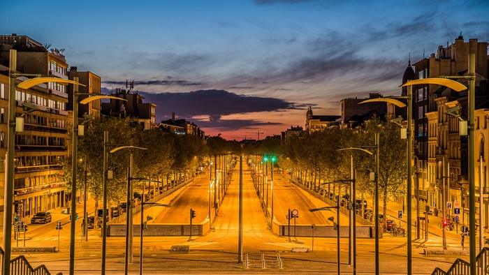 Street lights on a wide avenue at dusk in Antwerpen
