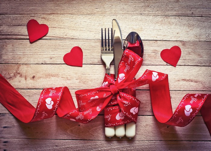 Valentine's Day cutlery with red ribbon and hearts
