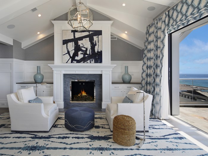Living room with fireplace and ocean view