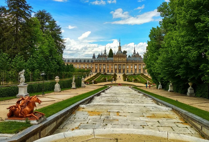 Royal Palace of La Granja gardens with stairs and sculptures