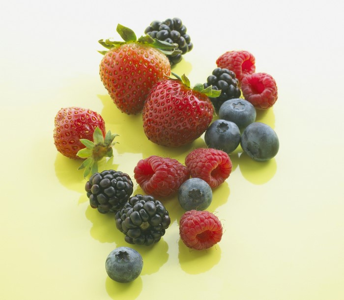 Assortment of fresh berries including strawberries, blueberries, raspberries, and blackberries